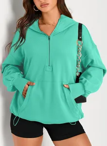 Women's teal half-zip hooded sweatshirt featuring a front kangaroo pocket and ribbed cuffs.