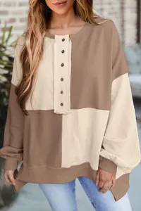 Detailed view of women's casual color-block oversized longline henley sweatshirt