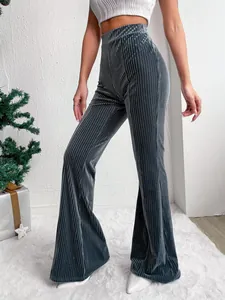 Close-up detail of women's high-waisted grey corduroy flare pants with vertical ribbing texture