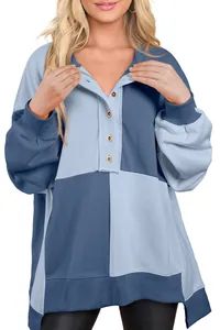 Close-up view of a casual women's color-block sweatshirt with button-down collar details