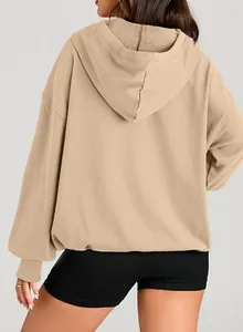 Back view of a khaki women's oversized hoodie sweatshirt with soft fabric texture
