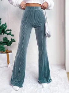 Detailed view of teal high-waisted corduroy flare pants with vertical ribbed texture