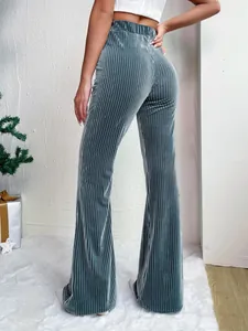 Detail view of high-waisted ribbed corduroy flare pants in dusty blue color