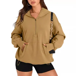 Women's oversized khaki hoodie with quarter-zip and kangaroo pocket on white background.