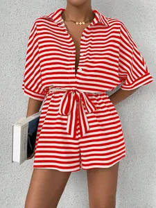 Close-up detail of a red and white striped rompers set with lapel collar and waist belt