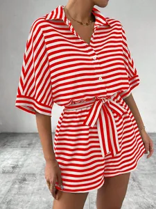 Detail of red and white striped two-piece set featuring button-down shirt and tied shorts