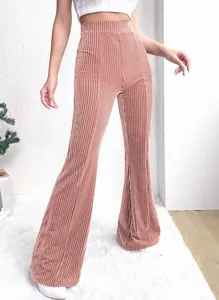 Detailed view of high-waisted ribbed corduroy flare pants in dusty rose fabric