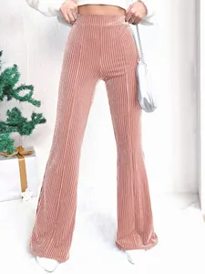Close-up of pink high-waisted corduroy flared trousers with vertical rib texture