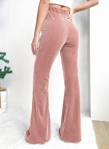 Back view detail of pink high-waisted ribbed corduroy flared pants for women