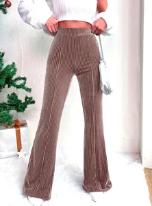 Detailed view of brown high-waisted corduroy flared pants with ribbed texture