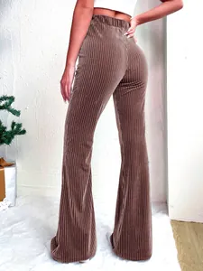 Brown high waisted corduroy flared pants back view showing ribbed texture and wide leg fit