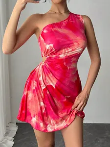 Close-up of pink printed pleated one-shoulder dress with side cutout detail