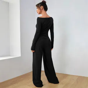 Elegante set nero a due pezzi con top a maniche lunghe e pantaloni a gamba larga