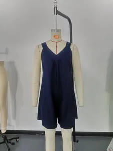 Professional studio view of a navy blue sleeveless waffle knit romper on a mannequin.