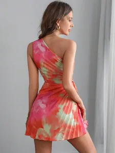 Back view of a vibrant tie-dye floral print pleated one-shoulder mini party dress