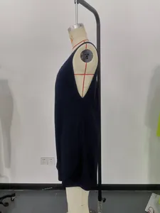 Detailed side view of a navy blue waffle knit sleeveless romper for women on a mannequin