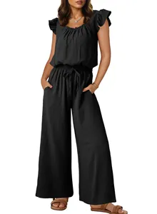 Detail view of women's black ruffled sleeveless jumpsuit with textured fabric and pockets.
