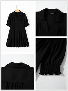 Detail view of black V-neck tiered dress with smocked sleeve cuffs and pleated texture