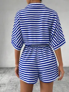 Back view of a blue and white striped half-sleeve shirt and high-waisted shorts set