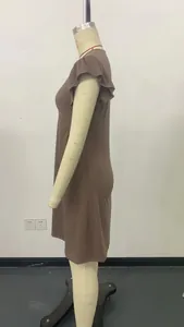 Detailed side view of a brown casual summer dress featuring elegant ruffled sleeves on a mannequin