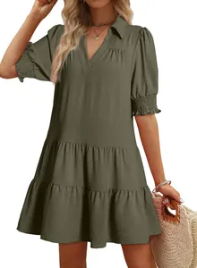 Detail view of women's olive green tiered dress with V-neck and pleated puffed sleeves