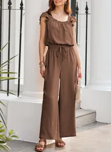 Detail view of women's brown pleated jumpsuit with drawstring waist and ruffle sleeves
