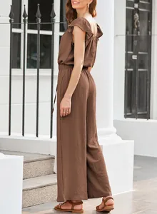 Full side view of a brown pleated jumpsuit featuring ruffle sleeves and casual wide legs.