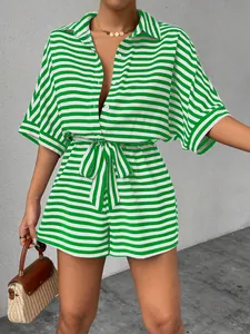Stylish green and white striped romper set featuring lapel collar and waist tie detail