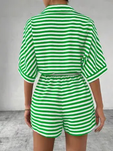 Back view detail of women's green and white horizontal striped shirt and shorts set