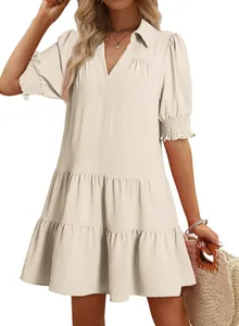 Detail view of cream pleated V-neck tiered mini dress with puff sleeves and collar
