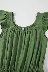 Detailed view of moss green pleated jumpsuit featuring gathered neckline and ruffled sleeves