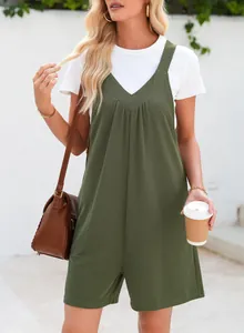 Detail shot of a women's green waffle knit sleeveless romper with side pockets and V-neck