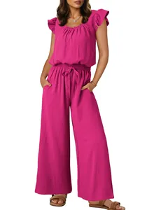 Front view of vibrant pink sleeveless jumpsuit featuring pleated fabric and ruffles