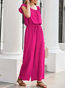 A detailed view of this women's magenta pleated jumpsuit with square neck and ruffle sleeves
