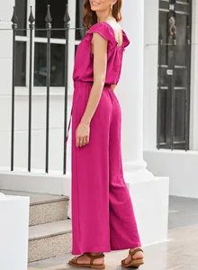 Side view of elegant magenta sleeveless jumpsuit with ruffle sleeves and pleated texture