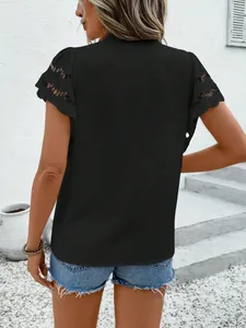Back view of black short sleeve top with lace eyelet sleeves and swiss dot texture