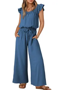 Full view of women's blue ruffled sleeveless jumpsuit with wide legs and pockets
