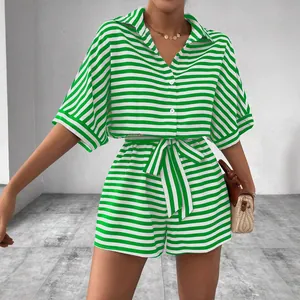 Stylish green and white striped two-piece set with button-down shirt and belted shorts.