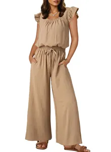 Close-up of beige ruffle sleeve jumpsuit featuring textured fabric and wide-leg design
