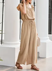 Khaki pleated sleeveless jumpsuit featuring ruffle square neck and drawstring waist