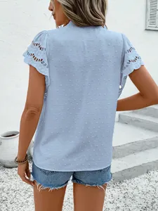 Detailed back view of a light blue Swiss dot top with elegant lace hollow sleeves.
