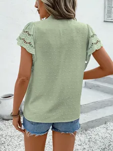 Back view of sage green top with eyelet lace sleeves and dotted texture