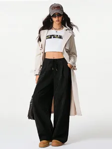 Trendy high-waisted black corduroy wide-leg pants for women featuring a functional drawstring
