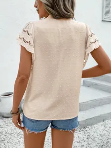 Back view detail of a beige short-sleeved top with lace hollow sleeves and dot texture
