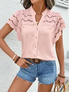 Detailed view of pink lace eyelet button-down shirt with textured fabric for women