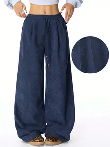 Detailed macro view showing navy blue corduroy fabric texture on high waist wide-leg pants