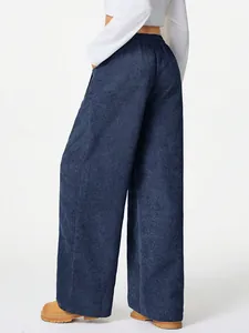 Back view of premium navy blue corduroy wide-leg pants with high waist and relaxed fit.