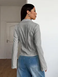 Detailed back view of a stylish grey vertical striped long-sleeve blouse for women