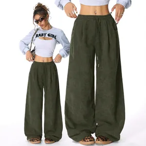 High-waisted olive green corduroy wide-leg pants with adjustable drawstring waist