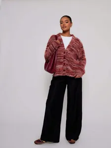Detailed view of burgundy fuzzy Maillard style long-sleeved cardigan with deep V-neck design